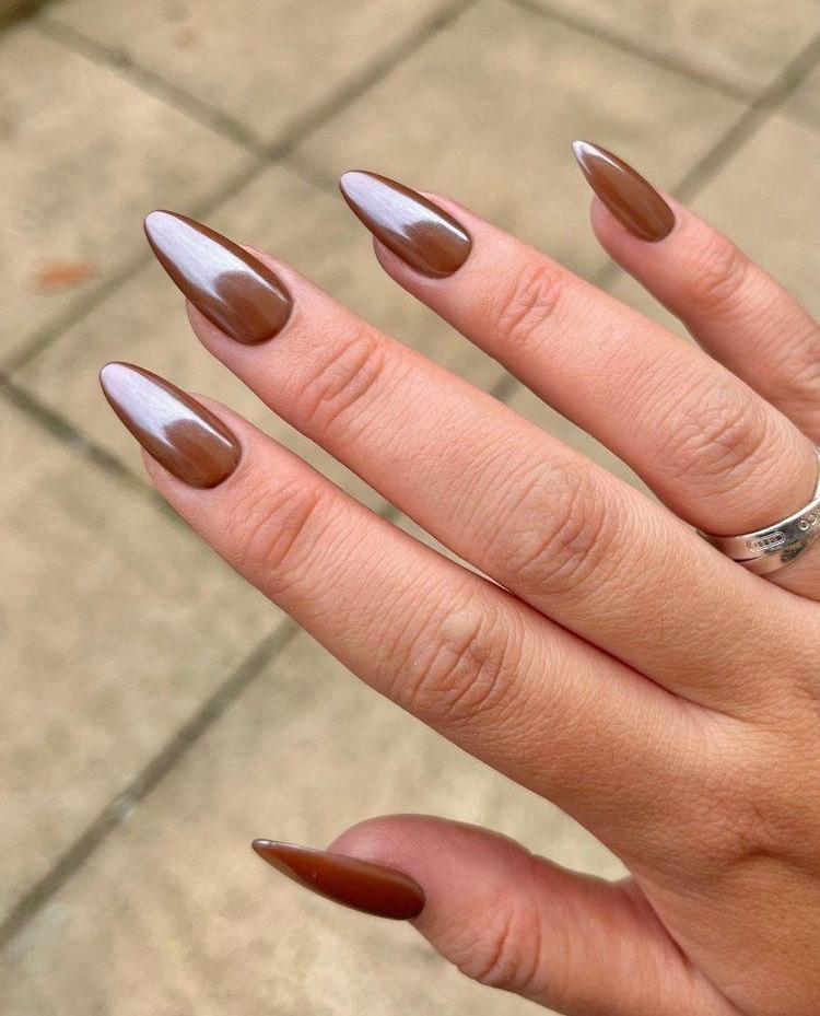 Almond nails with glossy caramel chrome finish
