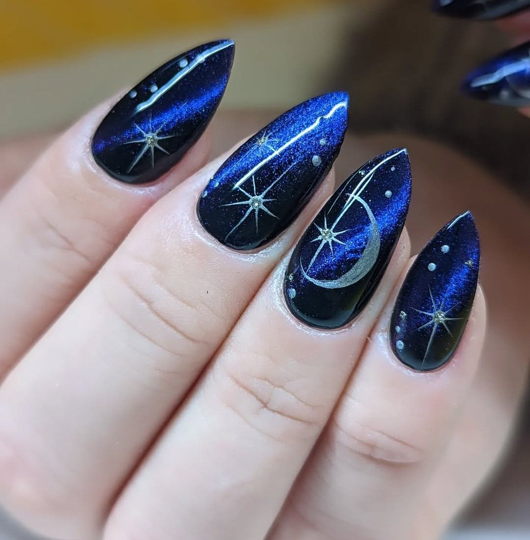 Navy cat eye nails with moon nail art
