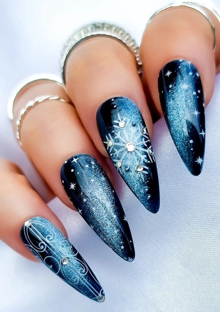 Black and blue glitter winter nails with snowflake