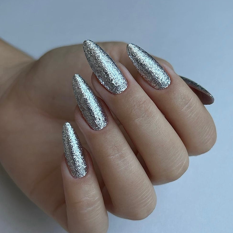 Stiletto nails covered in silver glitter
