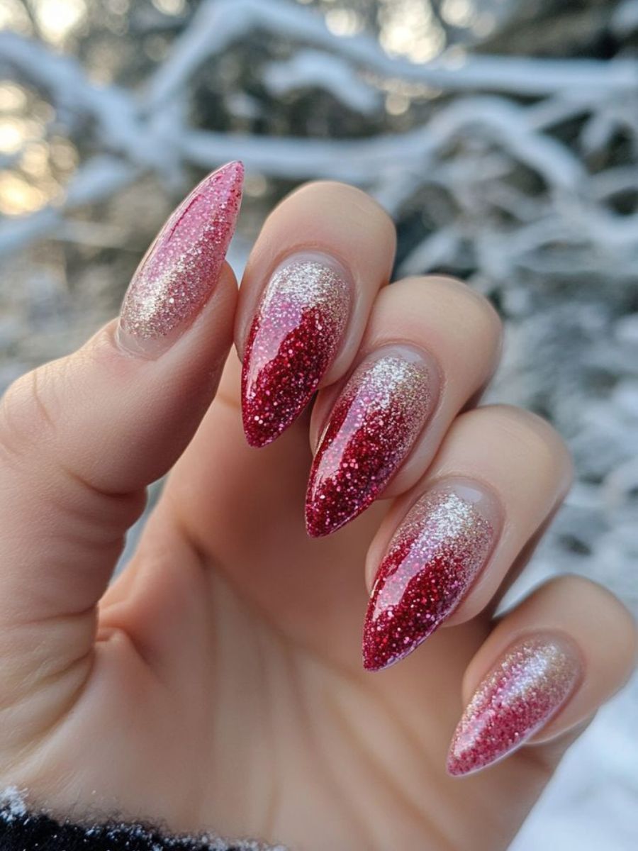 Red glitter ombre fading to champagne gold on long stiletto nails