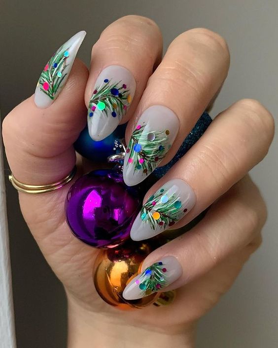 Milky white long oval nails with painted fir branches and colorful ornament dots