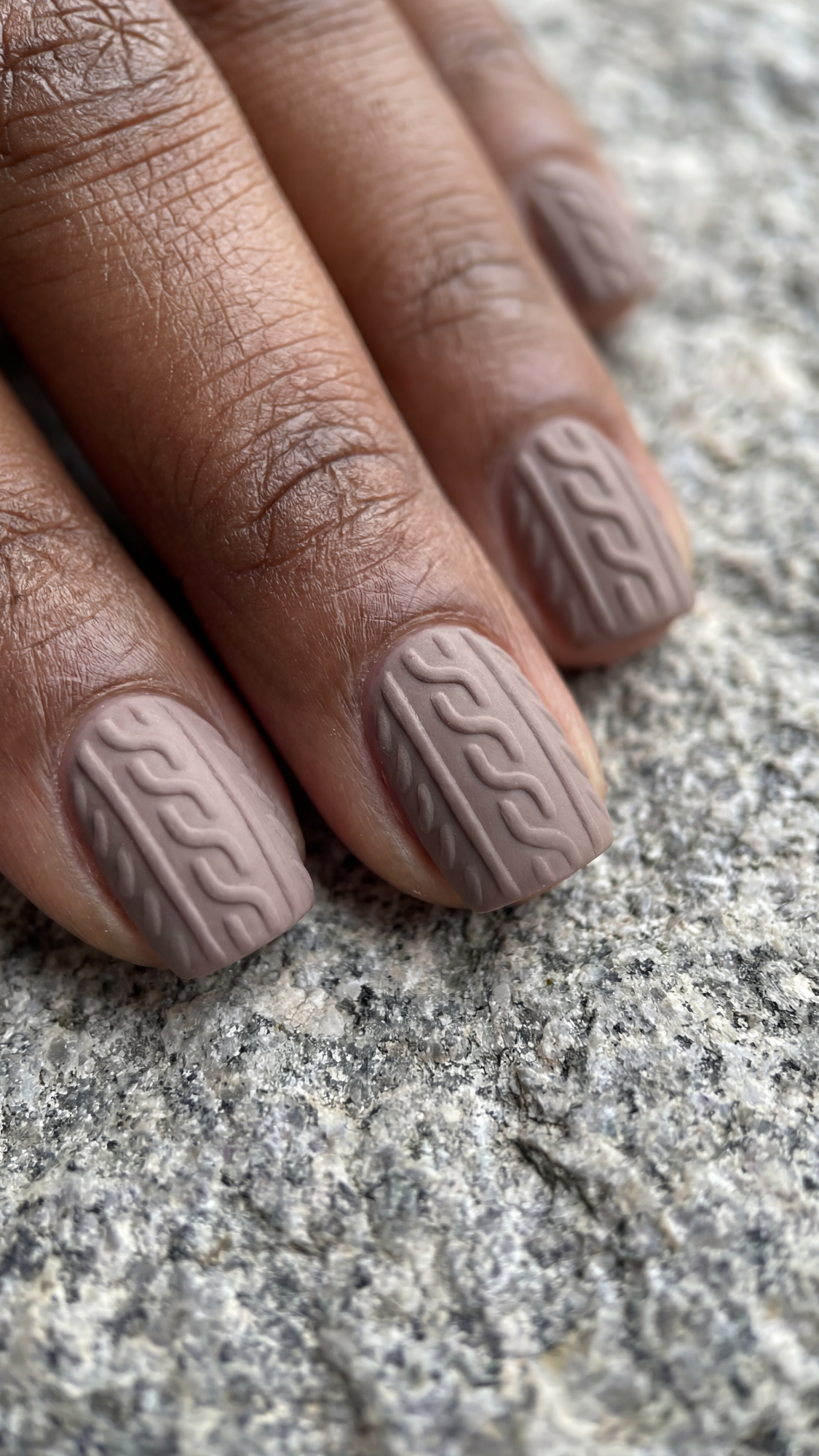 Matte taupe nails with embossed cable-knit sweater texture