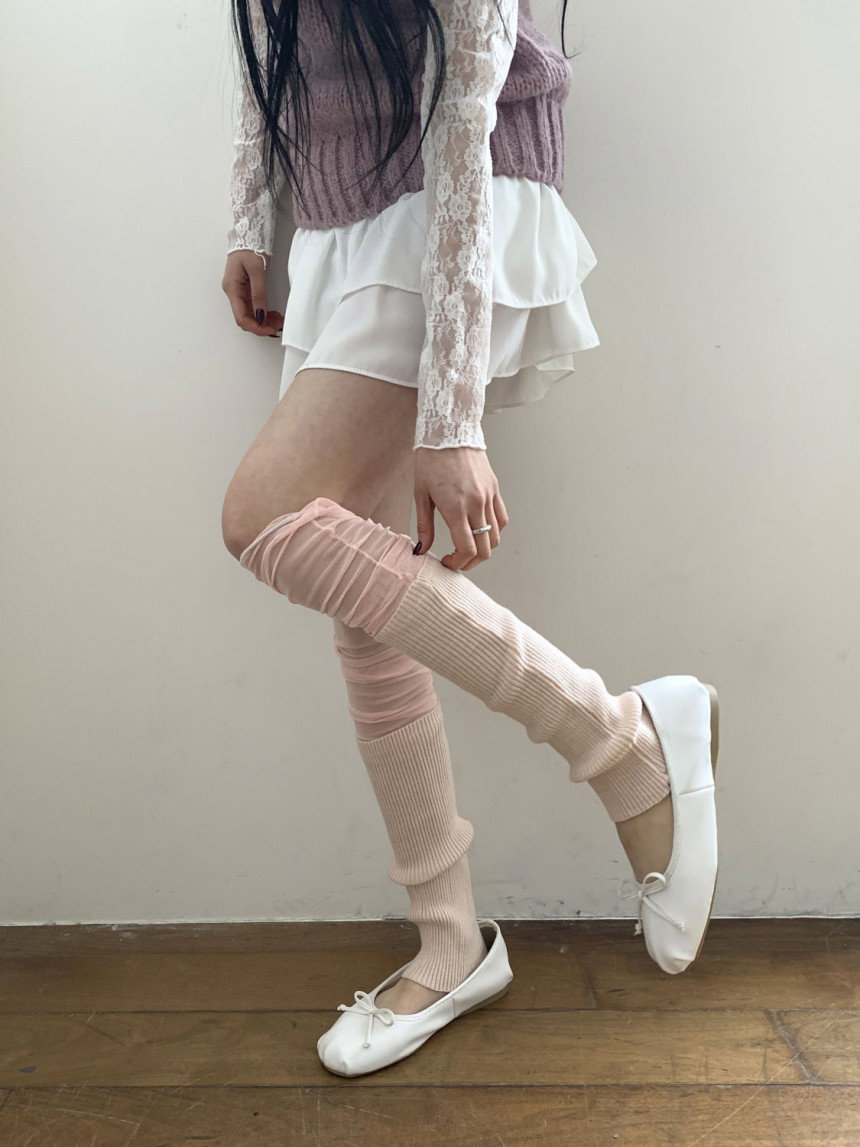 Blush pink ribbed leg warmers with white ballet flats, a lace sleeve blouse and a white ruffled mini skirt