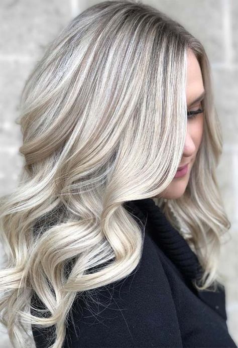 Platinum blonde hair with a dark shadow root