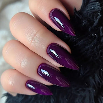 Dark purple glossy stiletto nails