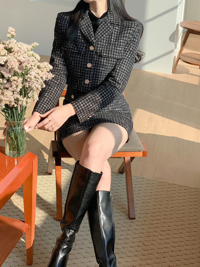 Tweed skirt suit styled with knee-high boots for winter