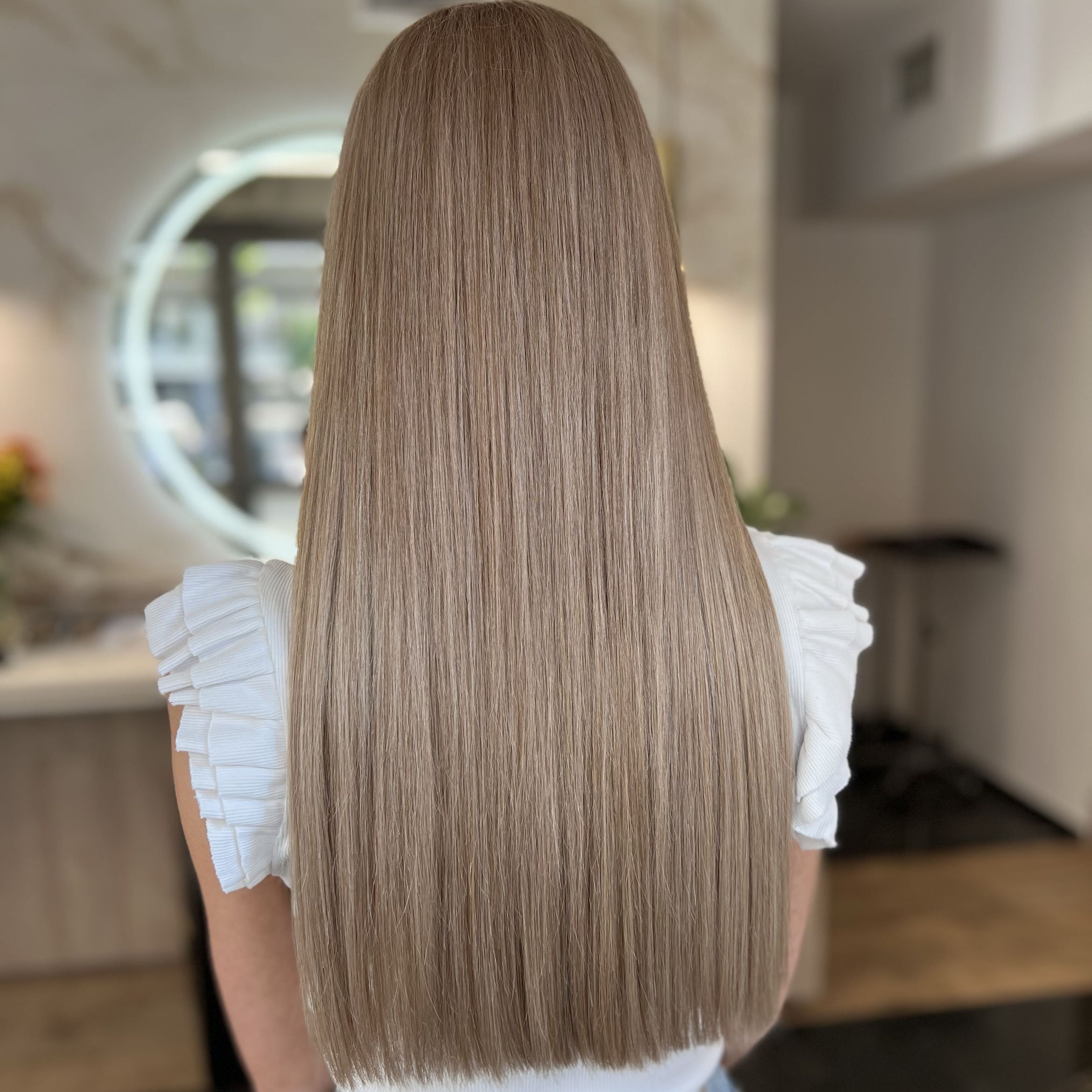 Back view of very long straight hair with a blunt, healthy one-length cut