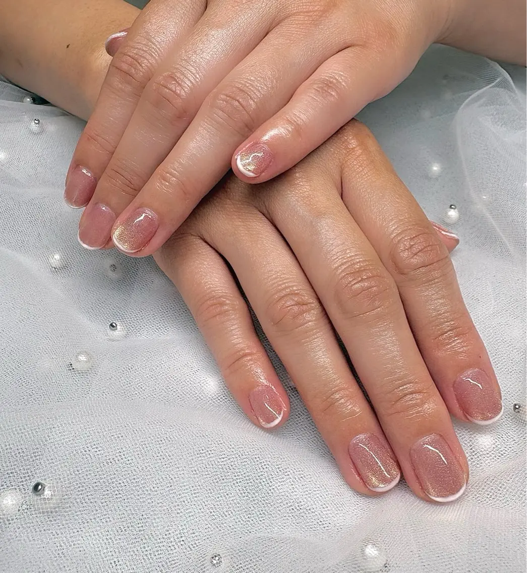 Pale Gold Cream: a pale gold-cream base with white-and-champagne French tips on short square nails