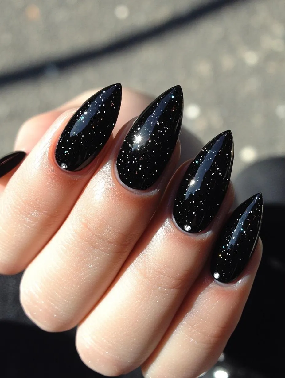 Almond nails in black glitter like a starry night sky
