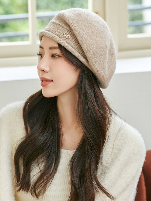 Woman wearing a knit beret with a winter dress