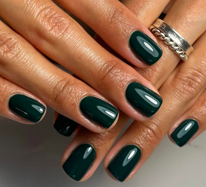 Dark forest green glossy manicure