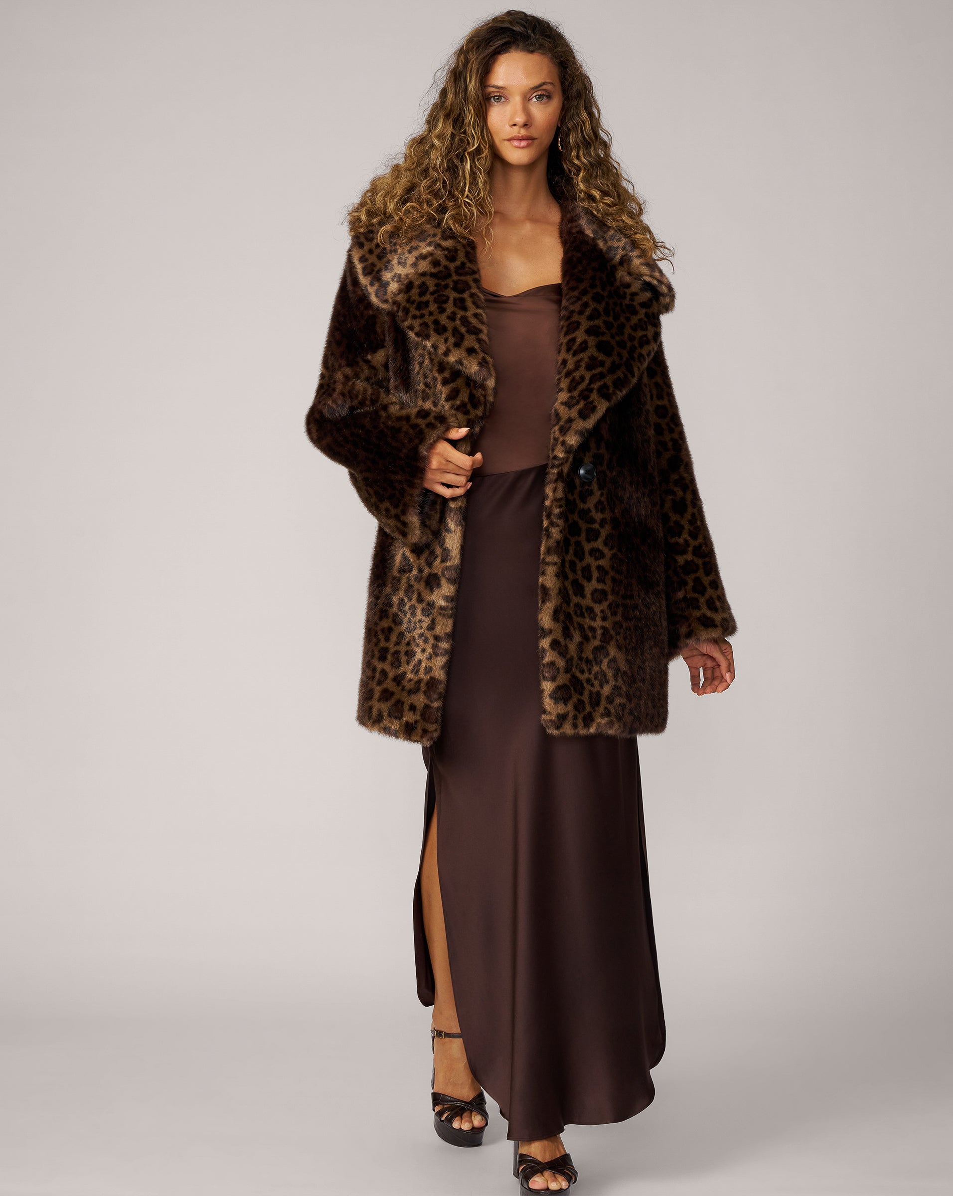 Cheetah print faux fur coat styled for evening
