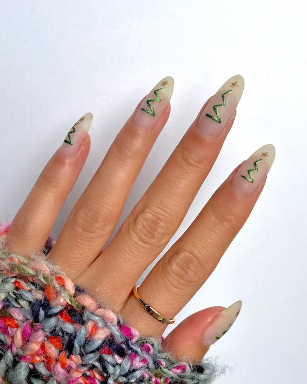 Sheer nude nails with abstract Christmas tree line art