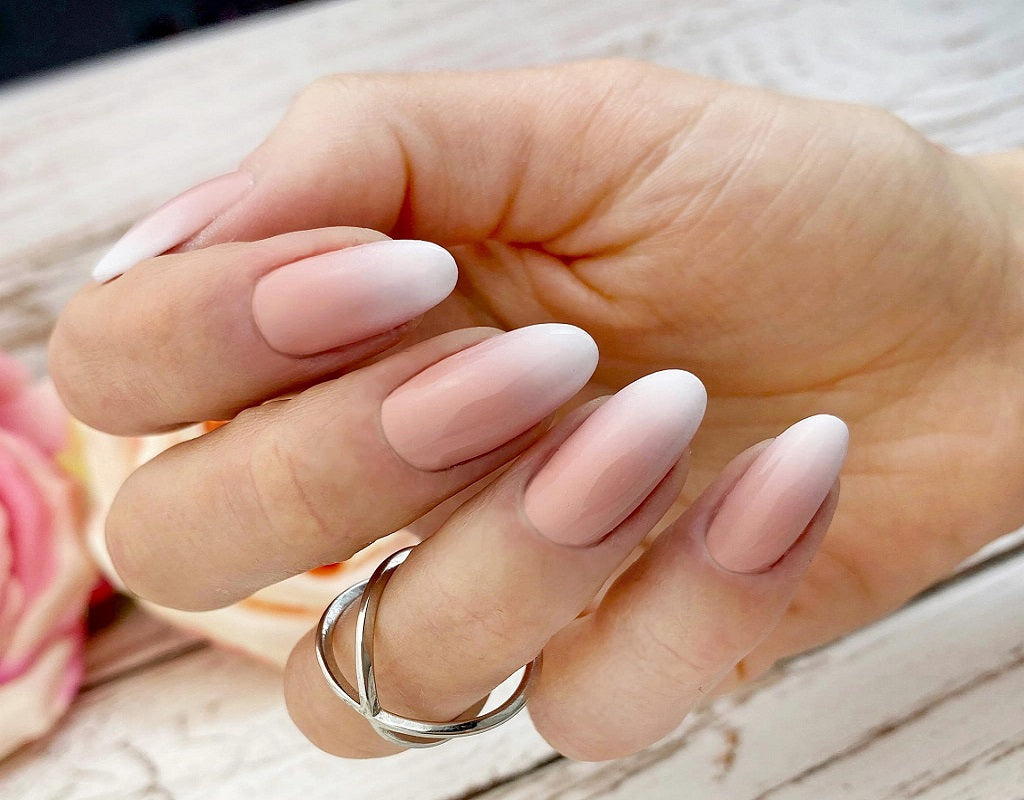 Almond nails with baby boomer white-to-nude ombre gradient