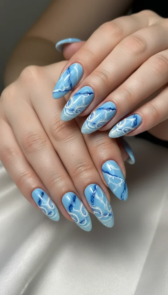 Icy blue marble nails with a frosted winter finish