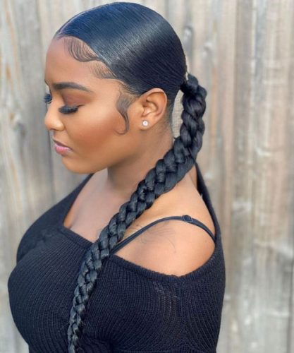 Sleek low ponytail with a braided wrap at the base
