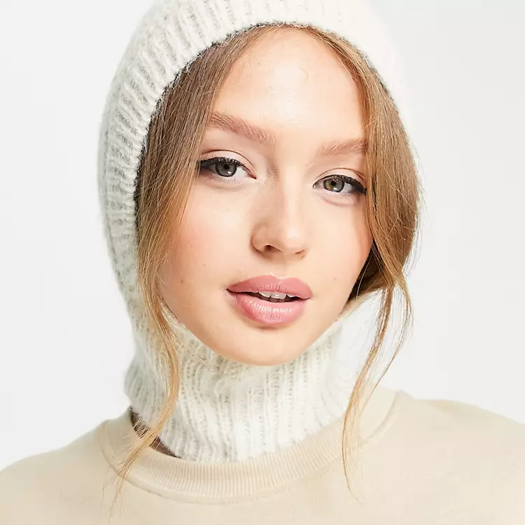 Close-up of a cream ribbed-knit balaclava hood