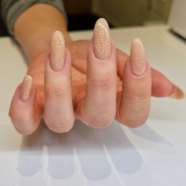 Champagne gold glitter nails on almond shape