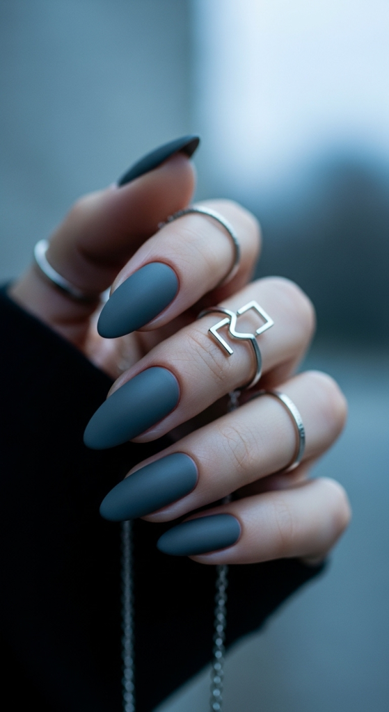 Charcoal Velvet: a soft-black matte on oval nails