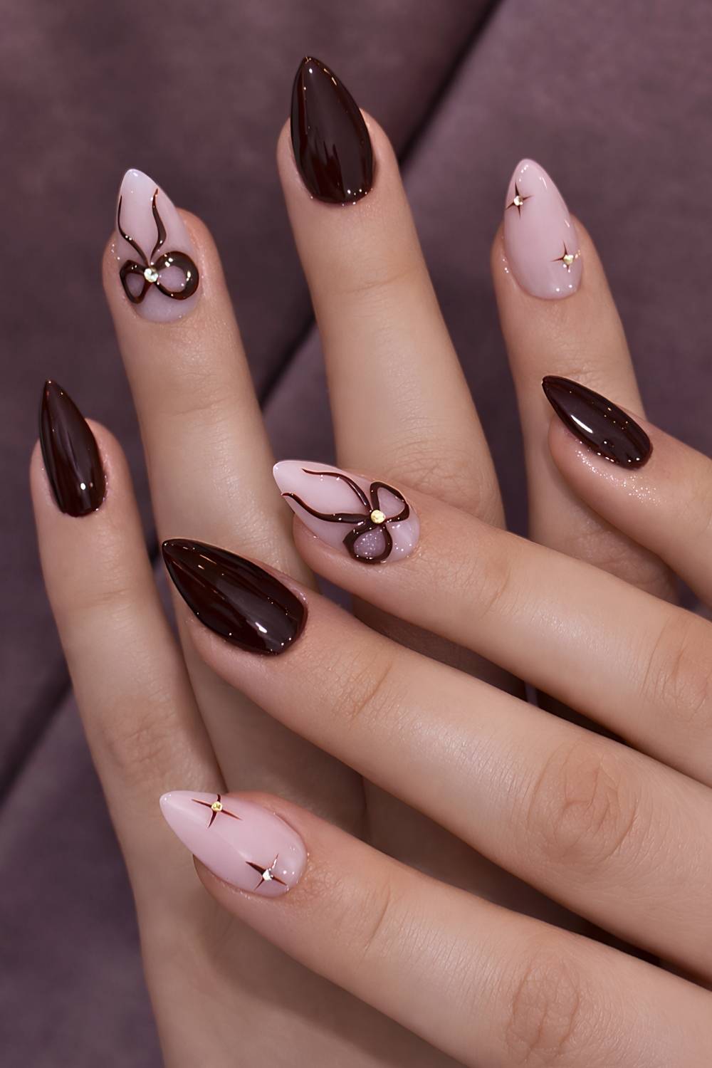Cherry mocha winter nails with textured bows
