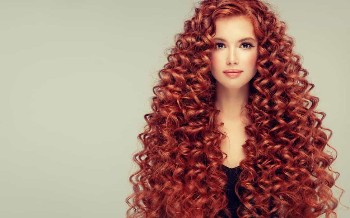 Rich auburn red on long curly hair
