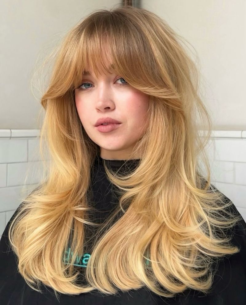 Bouncy blowout hairstyle with layered volume