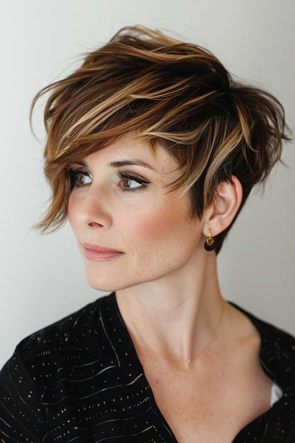 Honey caramel bixie haircut with chunky highlights