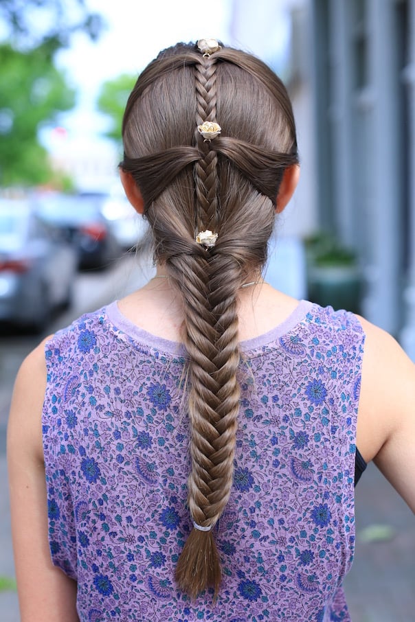 Long fishtail braid with gold rose hair pins, back view