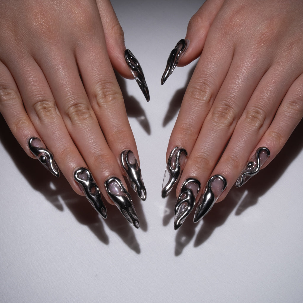 Molten chrome drip nail art on stiletto nails