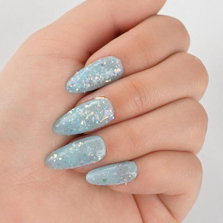 Icy blue nails with scattered holographic flakes