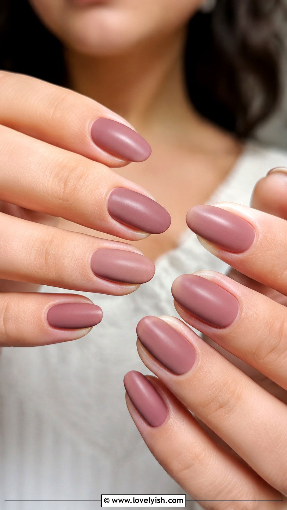 Dusty rose mauve-pink creme polish on nails