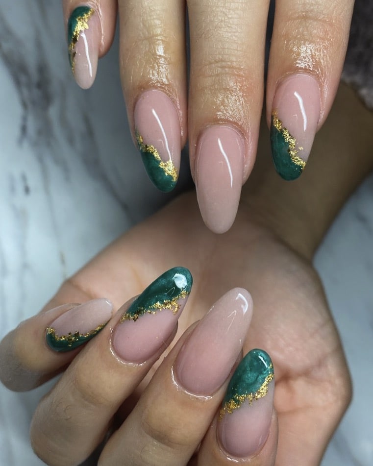 Emerald green nails with gold foil accent details