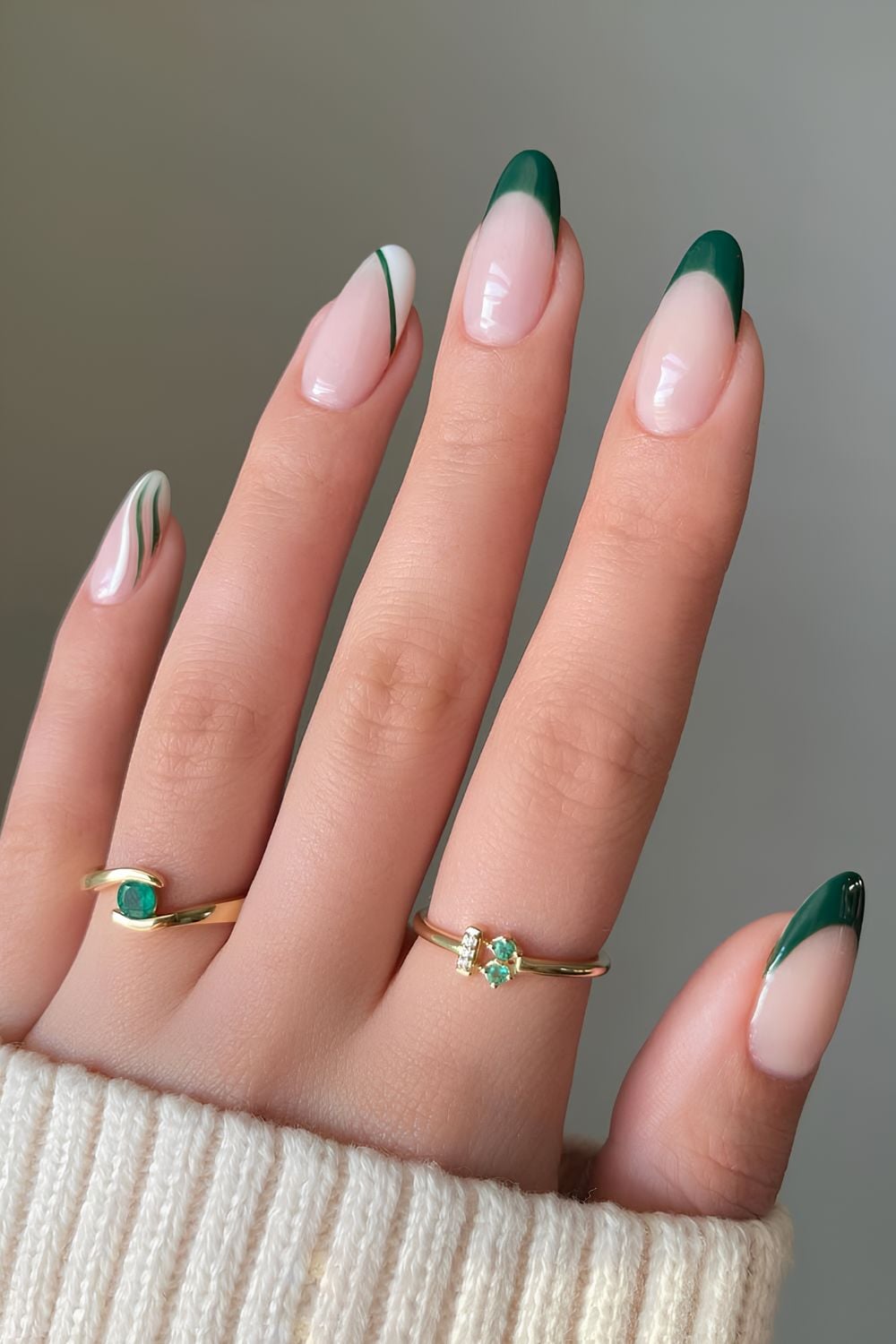 Sheer nude nails with emerald green French tips