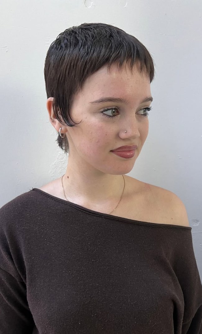 Very short textured espresso pixie crop with a micro fringe