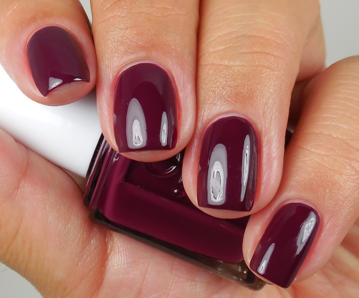 Deep burgundy oxblood creme polish on short rounded nails