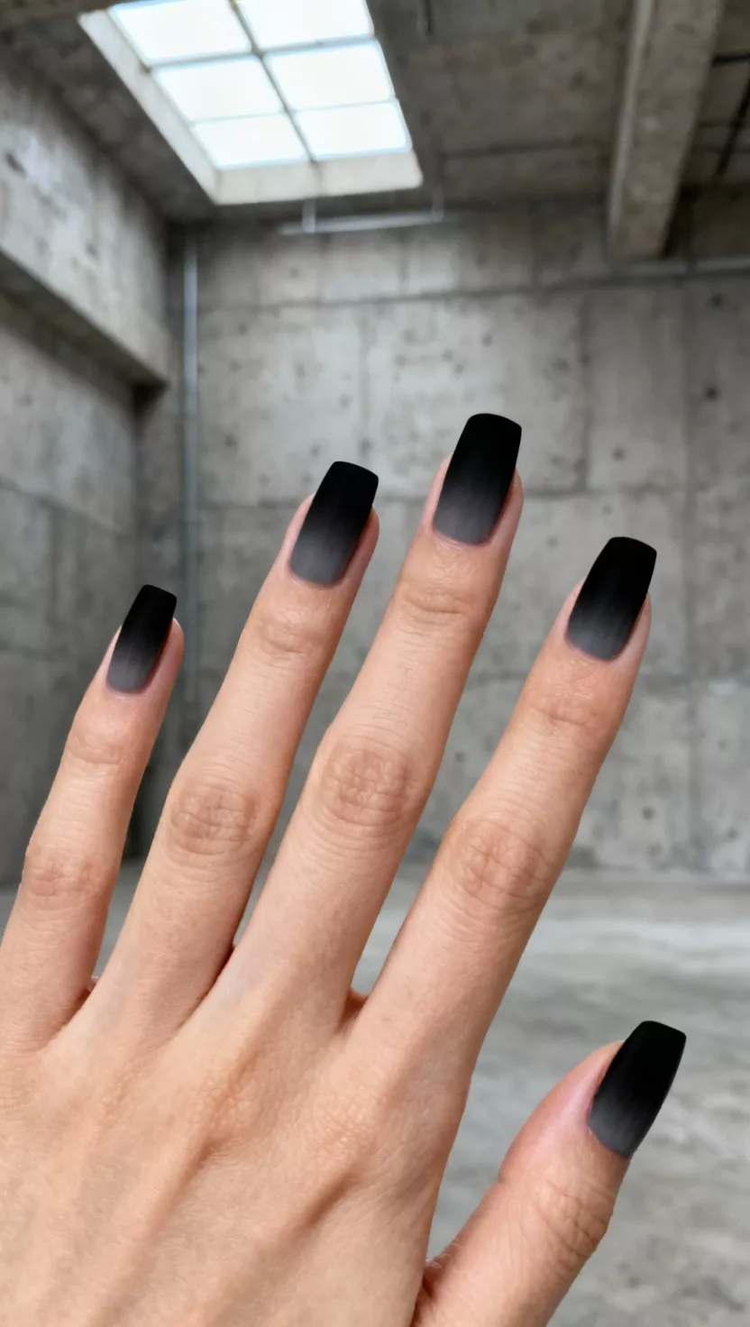 Square nails with jet black tips fading into soft grey at the cuticle, a smoky gradient