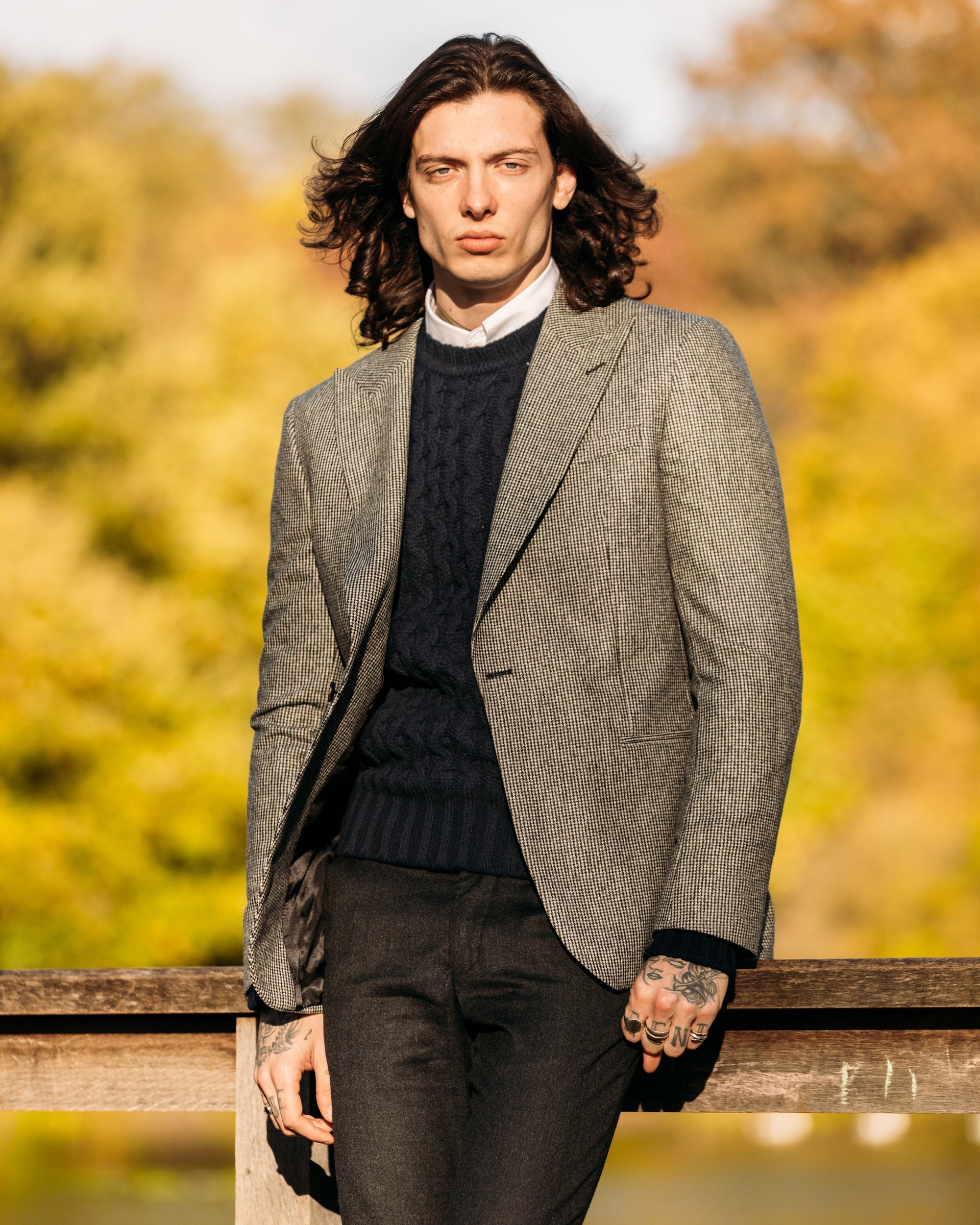 Man styling a chunky cable-knit jumper for winter