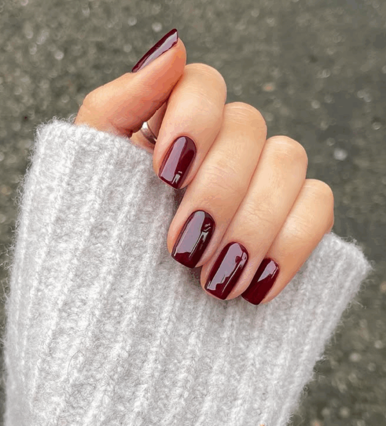 Medium squoval nails in classic glossy black cherry polish