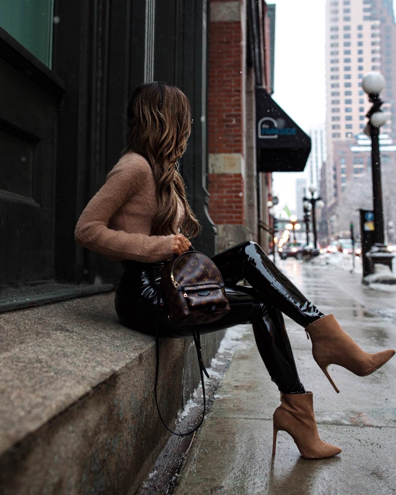 Fashion blogger wearing a tailored winter outfit for date night