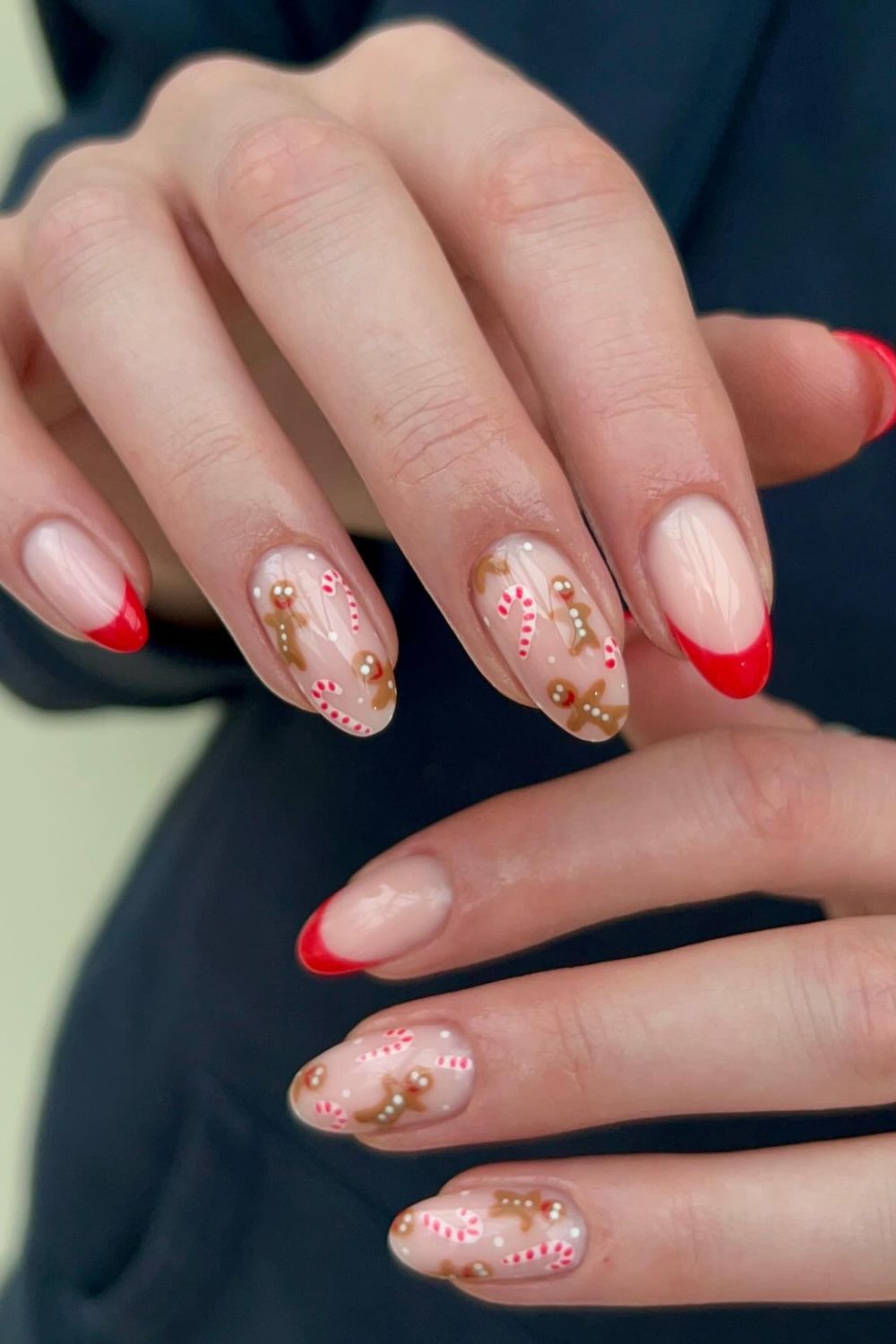 Sheer nude nails with gingerbread and candy cane art