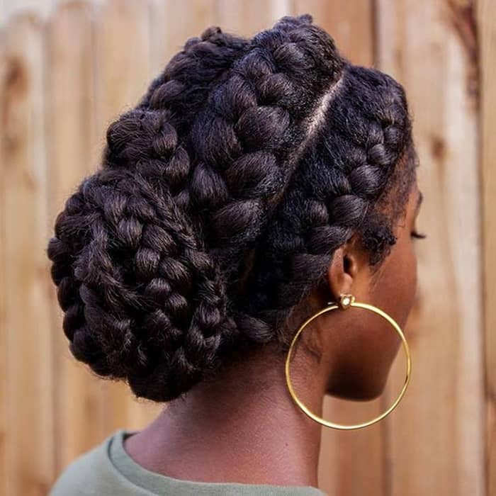 Chunky goddess braids gathered into a braided chignon bun