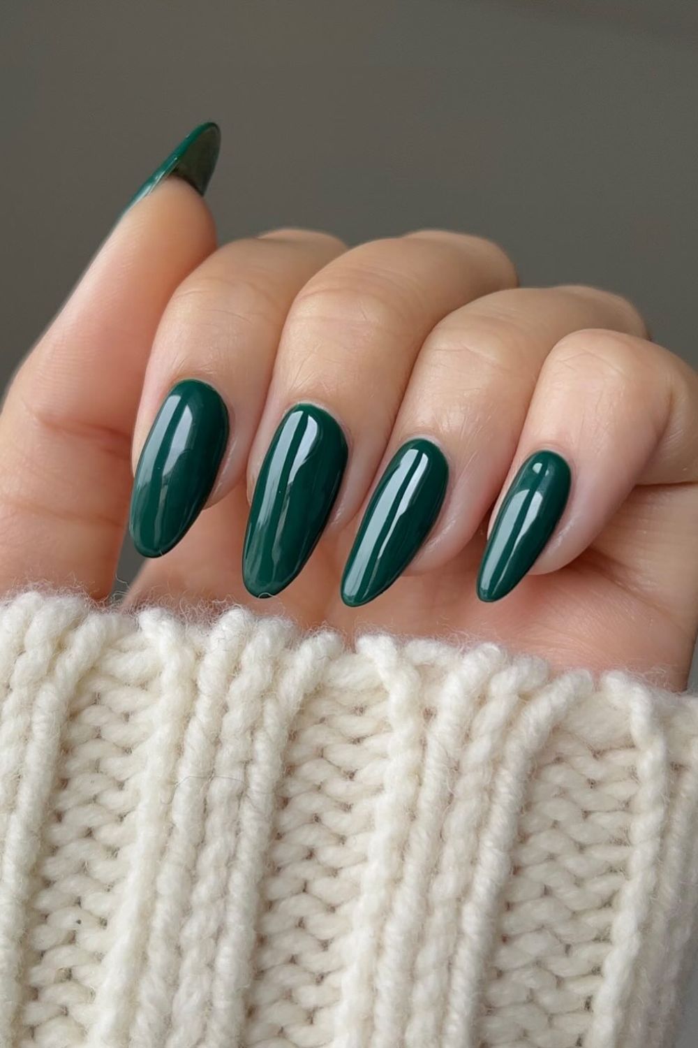 Sheer pink nails with forest green French tips
