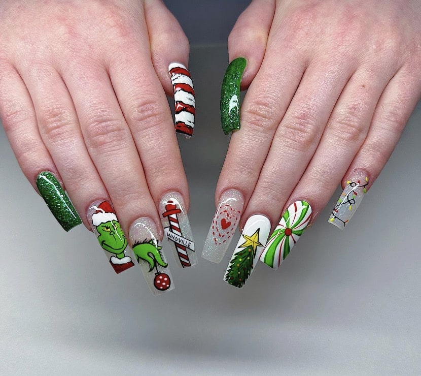 Square nails with Grinch art and a Christmas tree accent nail