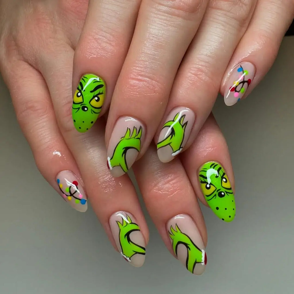 Short square nails mixing classic red and Grinch green with character art