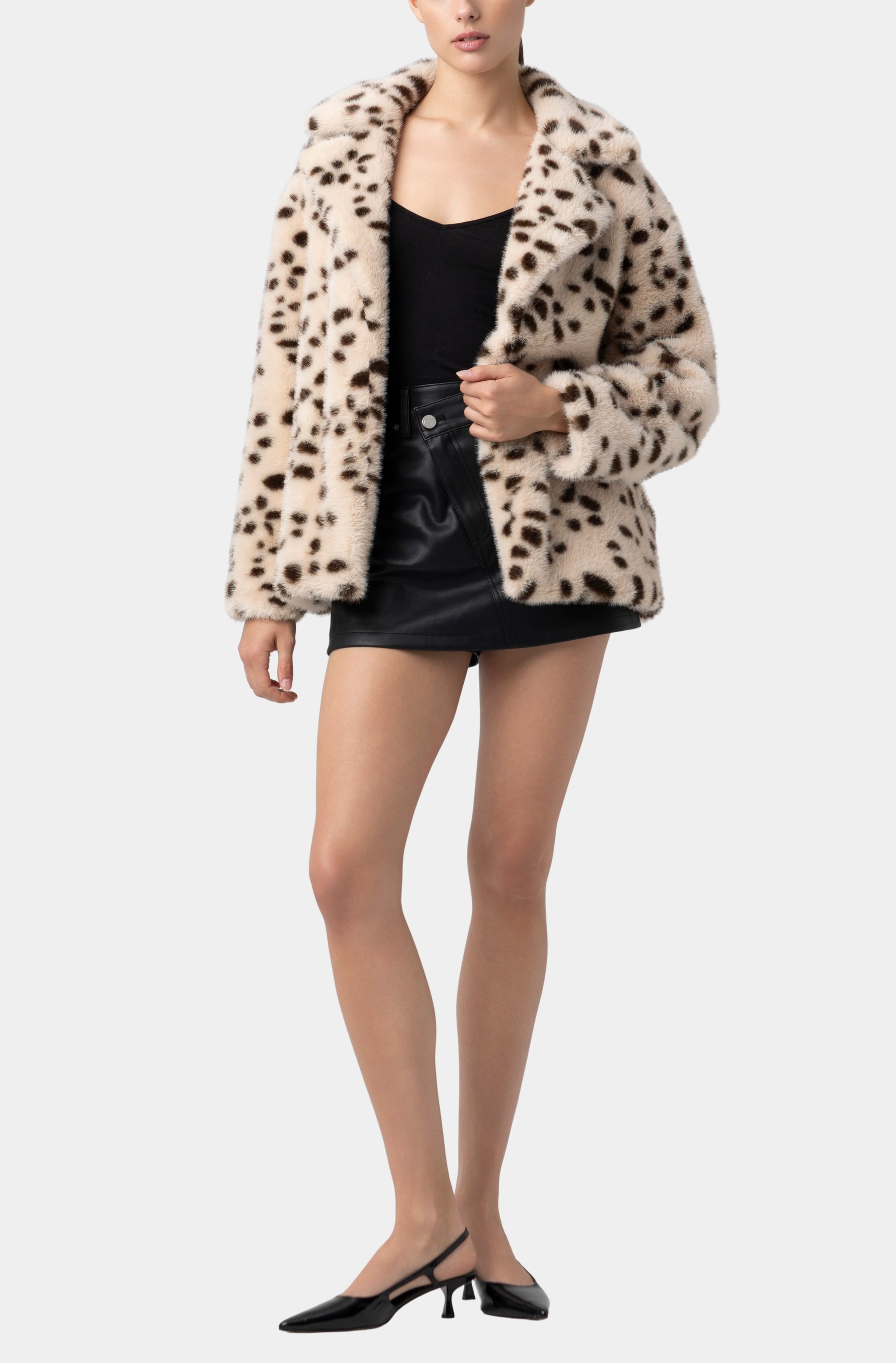 Leopard coat styled with warm camel and brown layers