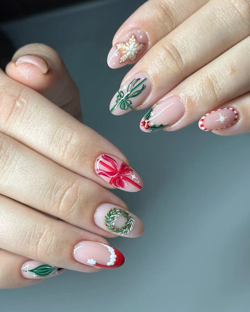 Almond press-on nails with Christmas wreath, red bow, snowflake and holly nail art