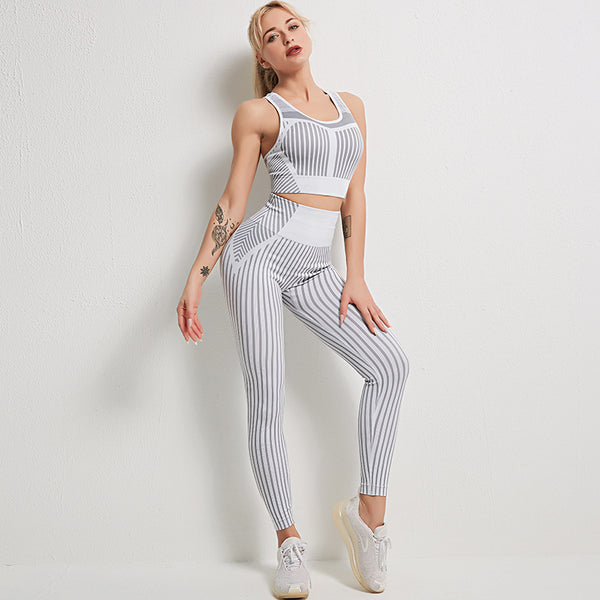 Woman wearing a striped sports bra and matching striped leggings set