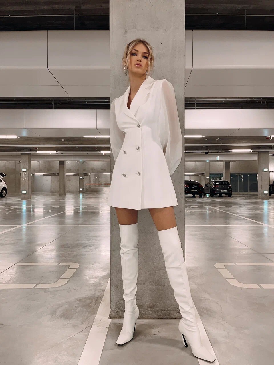 White over-the-knee boots with a white blazer mini dress
