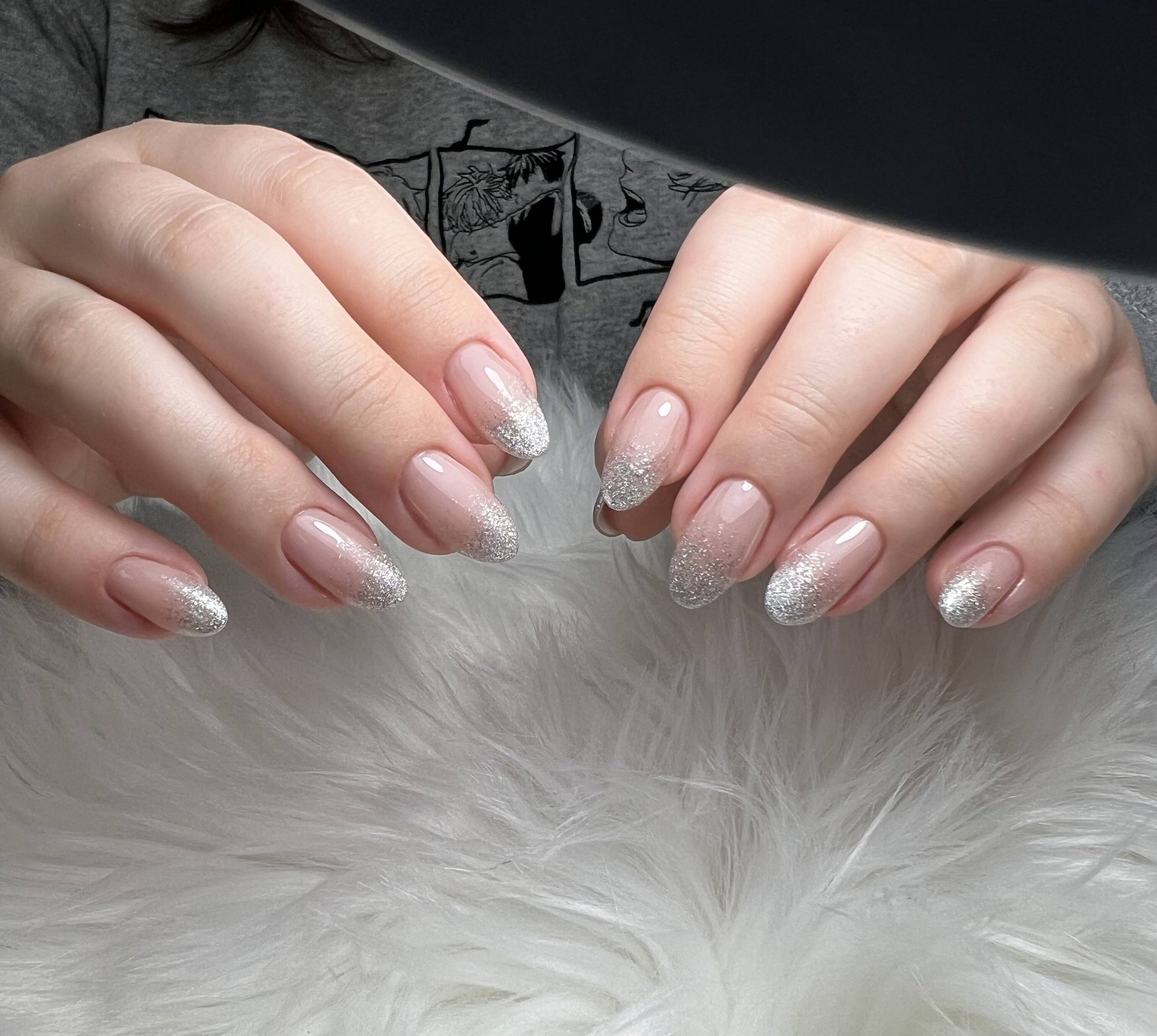 Silver glitter ombre fading from nude base to sparkling tips